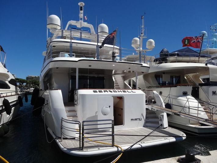a boat docked at a pier aboard SEA SHELL Yacht for Charter