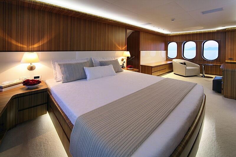 a hotel room with a bed and a desk aboard SEA SHELL Yacht for Charter