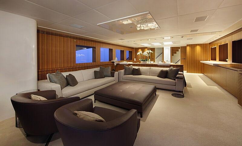 a large living room with a large window aboard SEA SHELL Yacht for Charter