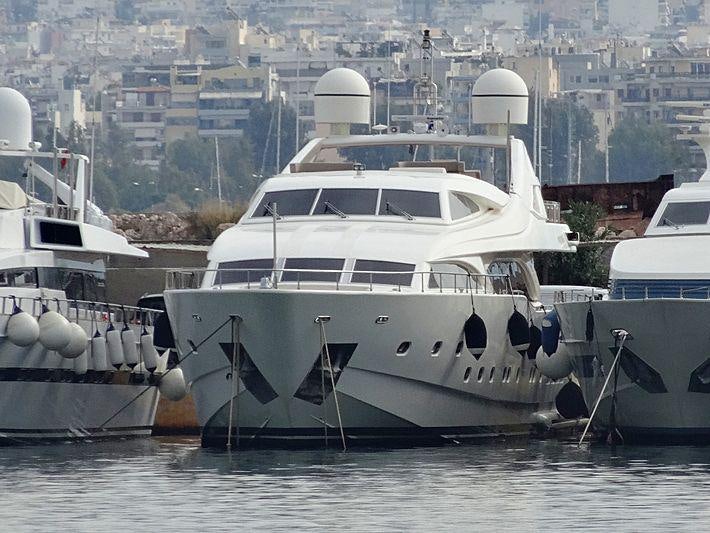 a group of boats in a harbor aboard WHISPER V Yacht for Charter