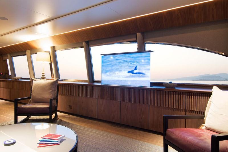 a room with a table and chairs aboard WHISPER V Yacht for Charter