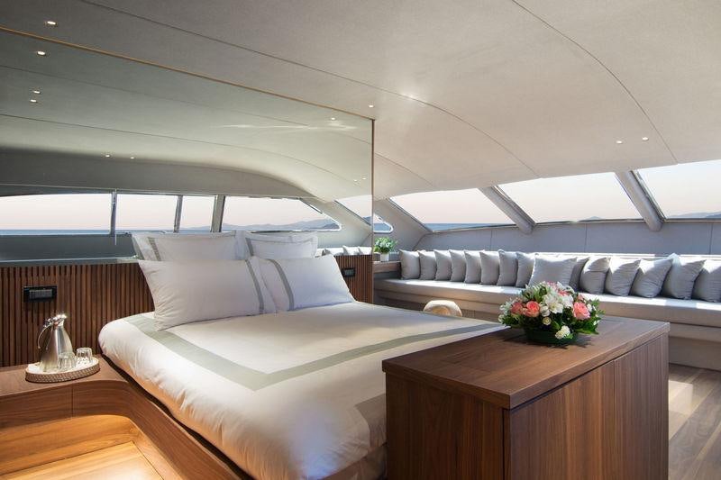 a bed with a white bed aboard WHISPER V Yacht for Charter