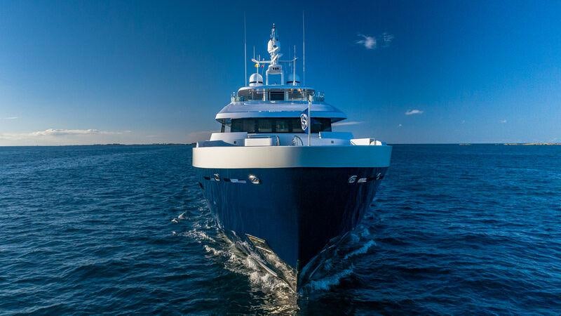 a large ship in the water aboard PISCES Yacht for Charter