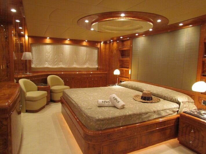 a large hotel room with a bed aboard KIRIOS Yacht for Charter
