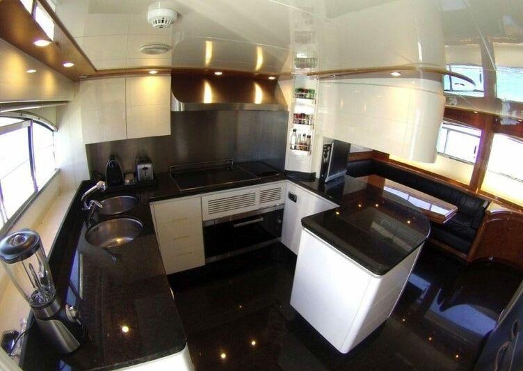 a kitchen with stainless steel appliances aboard KIRIOS Yacht for Charter