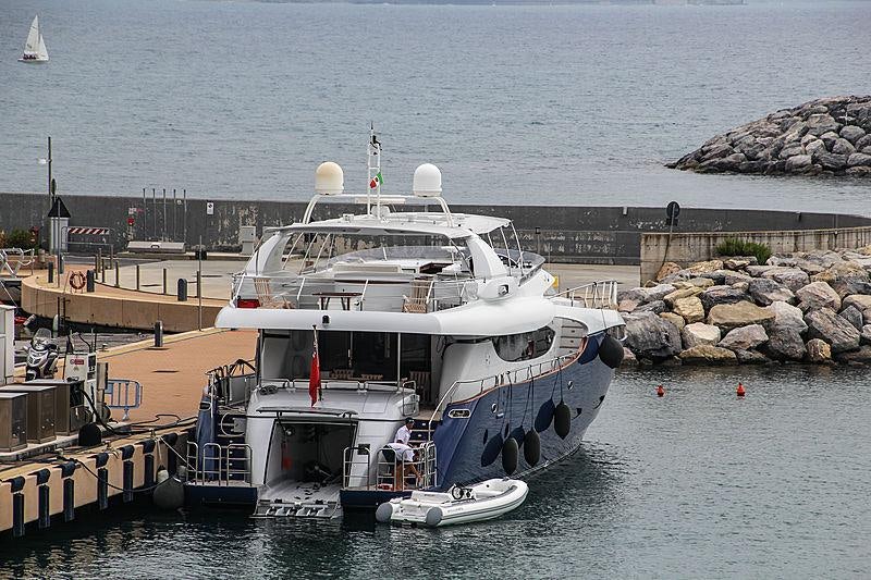 a boat is parked at a dock aboard CLARITY Yacht for Charter
