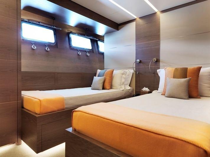 a room with two beds aboard NAIA Yacht for Charter
