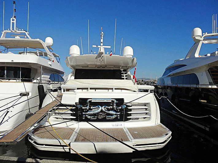 a group of boats are parked in a harbor aboard ASTRO Yacht for Charter