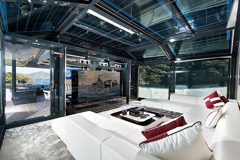 a room with a large bed and a large window aboard SUN Yacht for Charter