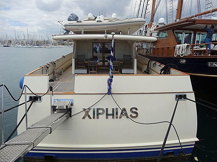 a boat docked at a pier aboard XIPHIAS Yacht for Charter