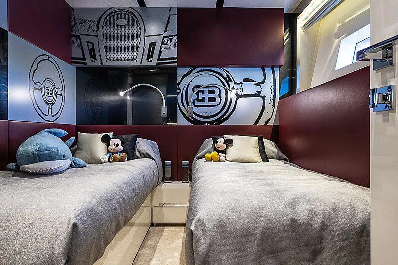 a room with a bed and a couch aboard CINQUANTA-50 Yacht for Charter