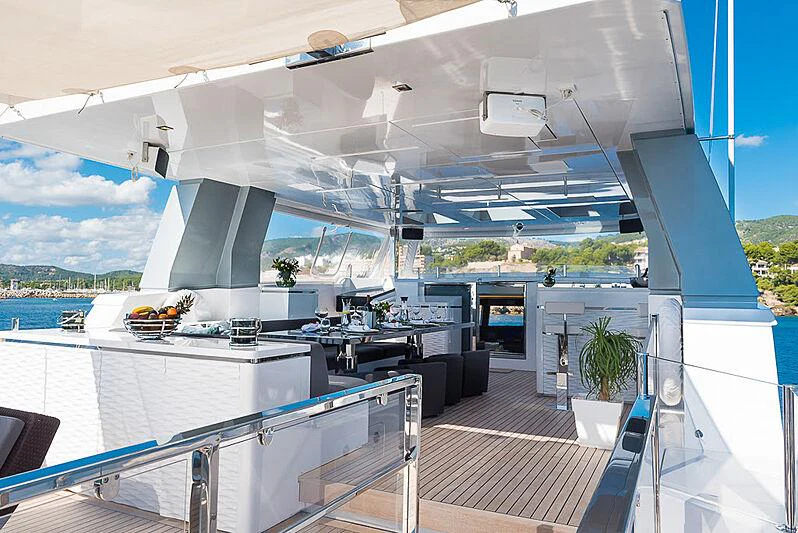 a deck with a pool and a deck with a view of the water aboard CINQUANTA-50 Yacht for Charter