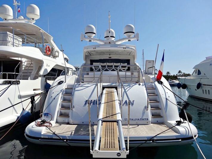 a boat docked at a pier aboard PHOENICIAN Yacht for Charter