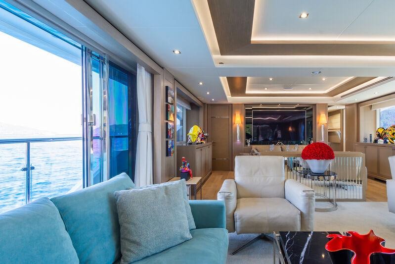 a living room with a large window aboard FREEDOM Yacht for Charter