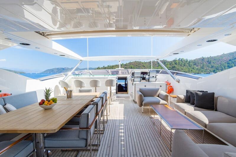 a room with a table and chairs aboard FREEDOM Yacht for Charter