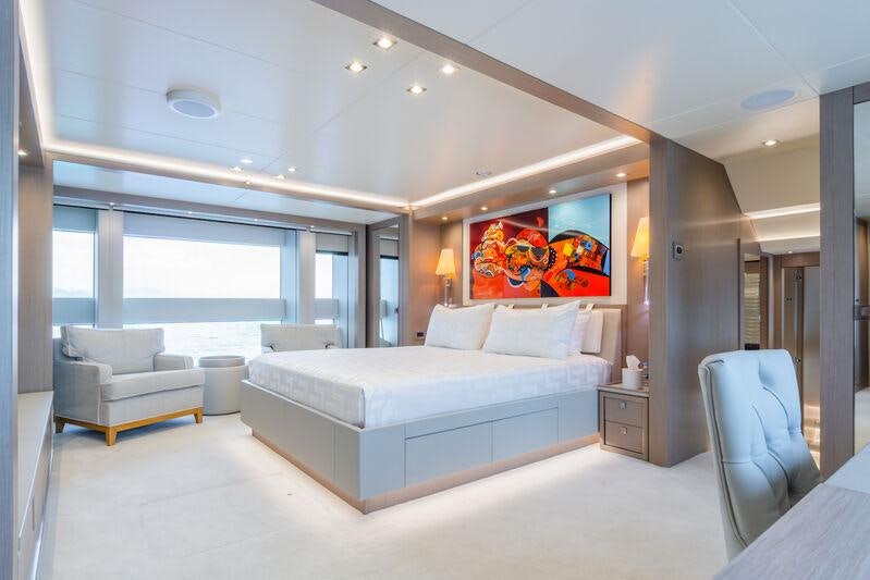 a large bedroom with a large window aboard FREEDOM Yacht for Charter