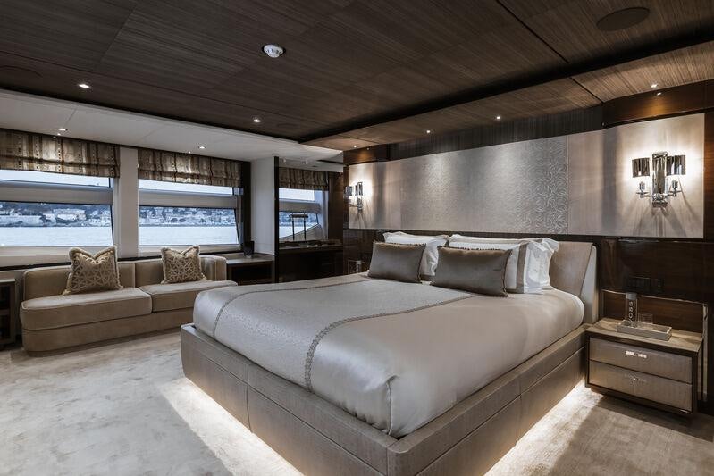 a large bed in a room aboard RIVIERA LIVING Yacht for Charter