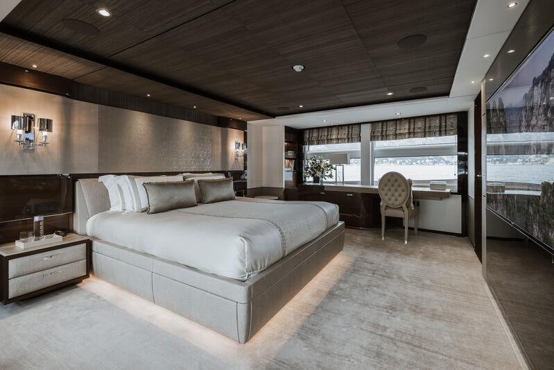 a large bedroom with a large bed aboard RIVIERA LIVING Yacht for Charter