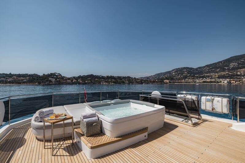 a boat on a deck aboard RIVIERA LIVING Yacht for Charter