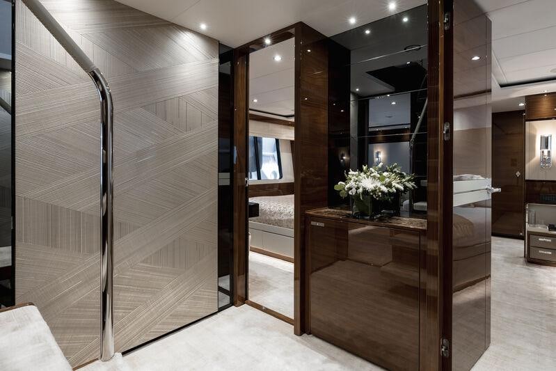 a room with a glass wall aboard RIVIERA LIVING Yacht for Charter