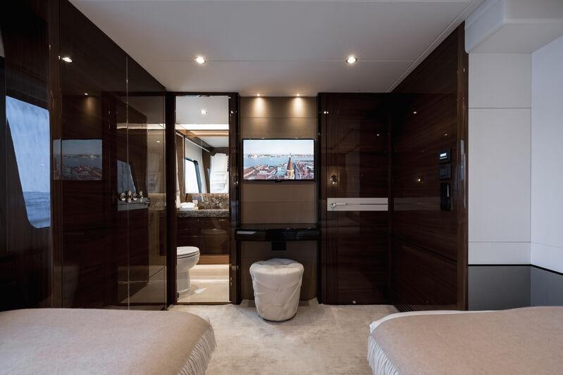 a bathroom with a large mirror aboard RIVIERA LIVING Yacht for Charter