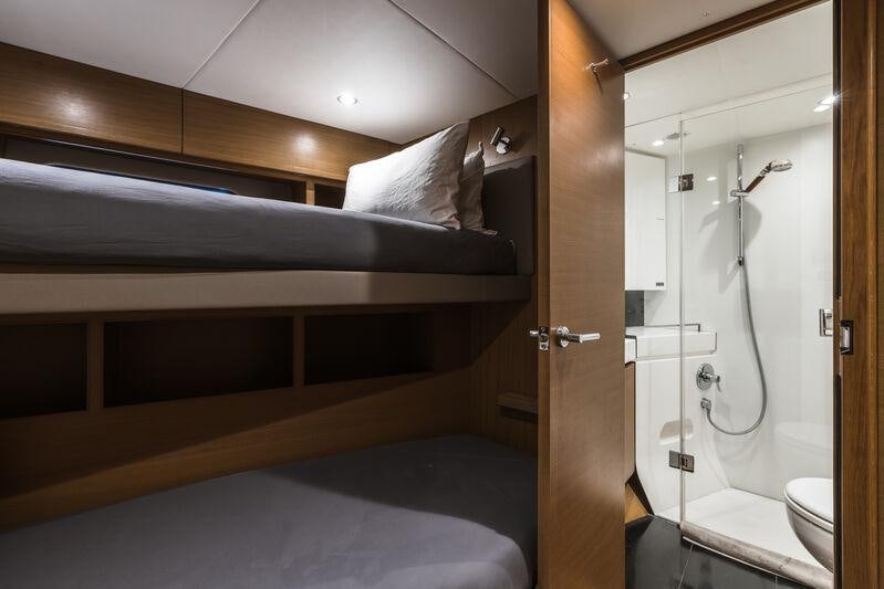 a bathroom with a shower unit and a toilet aboard RIVIERA LIVING Yacht for Charter