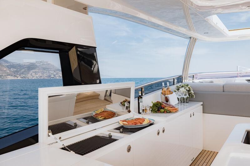 a boat with food on it aboard RIVIERA LIVING Yacht for Charter