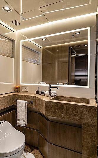 a bathroom with a large mirror aboard THE PEDDLER Yacht for Sale