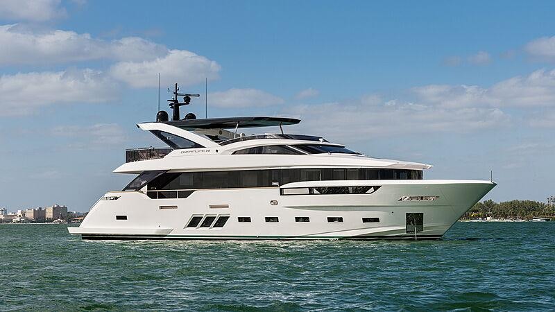 a white yacht in the water aboard THE PEDDLER Yacht for Sale