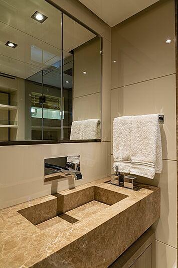 a bathroom with a large mirror aboard THE PEDDLER Yacht for Sale