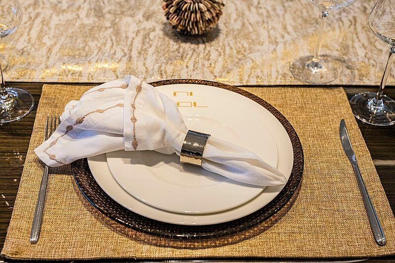 a plate with a napkin and a knife on it aboard THE PEDDLER Yacht for Sale