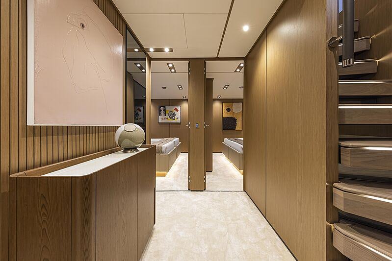a hallway with a large mirror aboard EPIC Yacht for Charter
