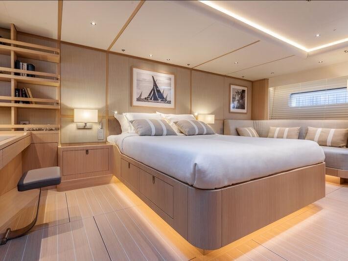a large bedroom with a large bed aboard ALIX Yacht for Sale