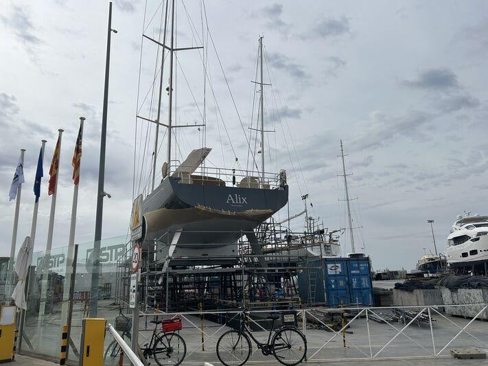 a boat docked at a pier aboard ALIX Yacht for Sale
