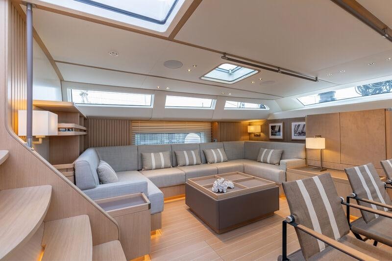 a living room with a couch and a table aboard ALIX Yacht for Sale