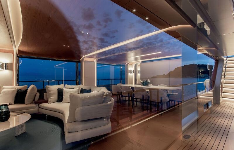 a living room with a large window aboard LEGEND Yacht for Charter