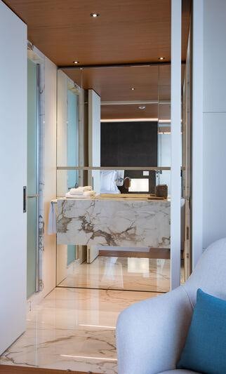 a room with a couch and a fireplace aboard LEGEND Yacht for Charter