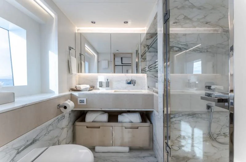 a bathroom with a sink and a toilet aboard OPTIMISM Yacht for Sale