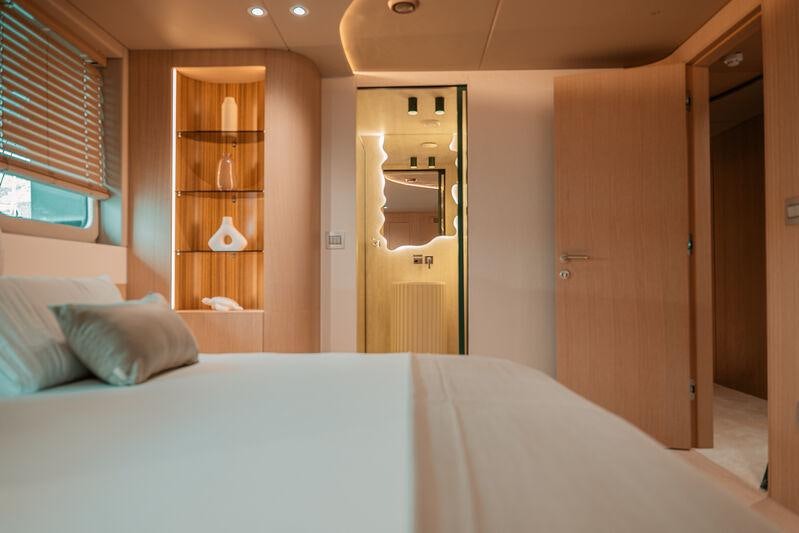 a bed in a room aboard REPOSADO Yacht for Charter