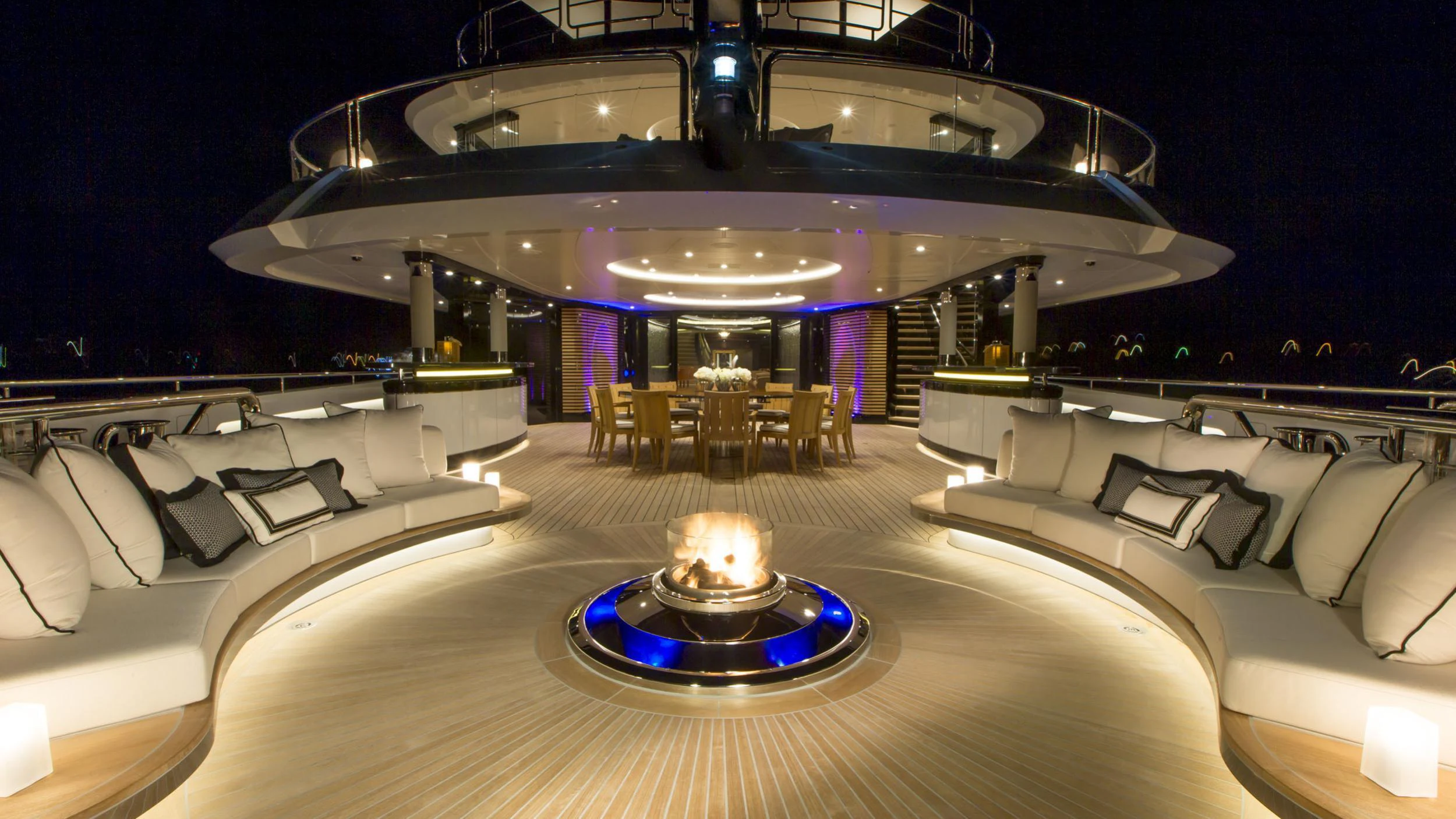 a room with a large chandelier and a large white couch aboard WHISPER Yacht for Charter