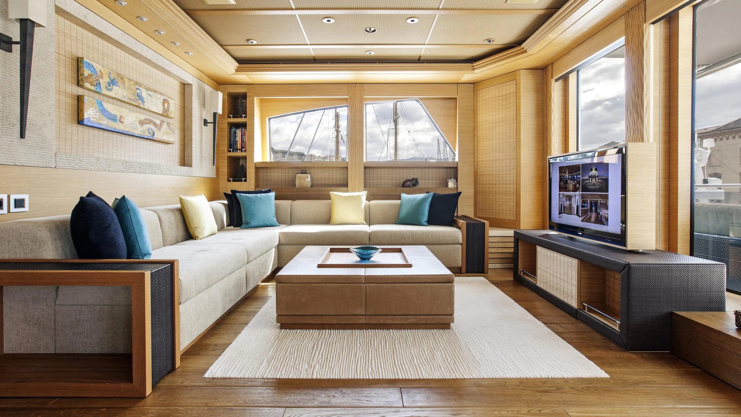 a living room with a large sofa aboard NAIA Yacht for Charter