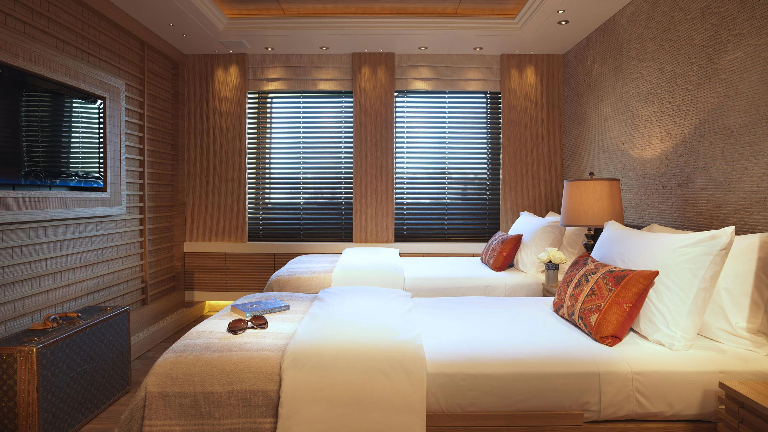 a bedroom with a large bed aboard NAIA Yacht for Charter