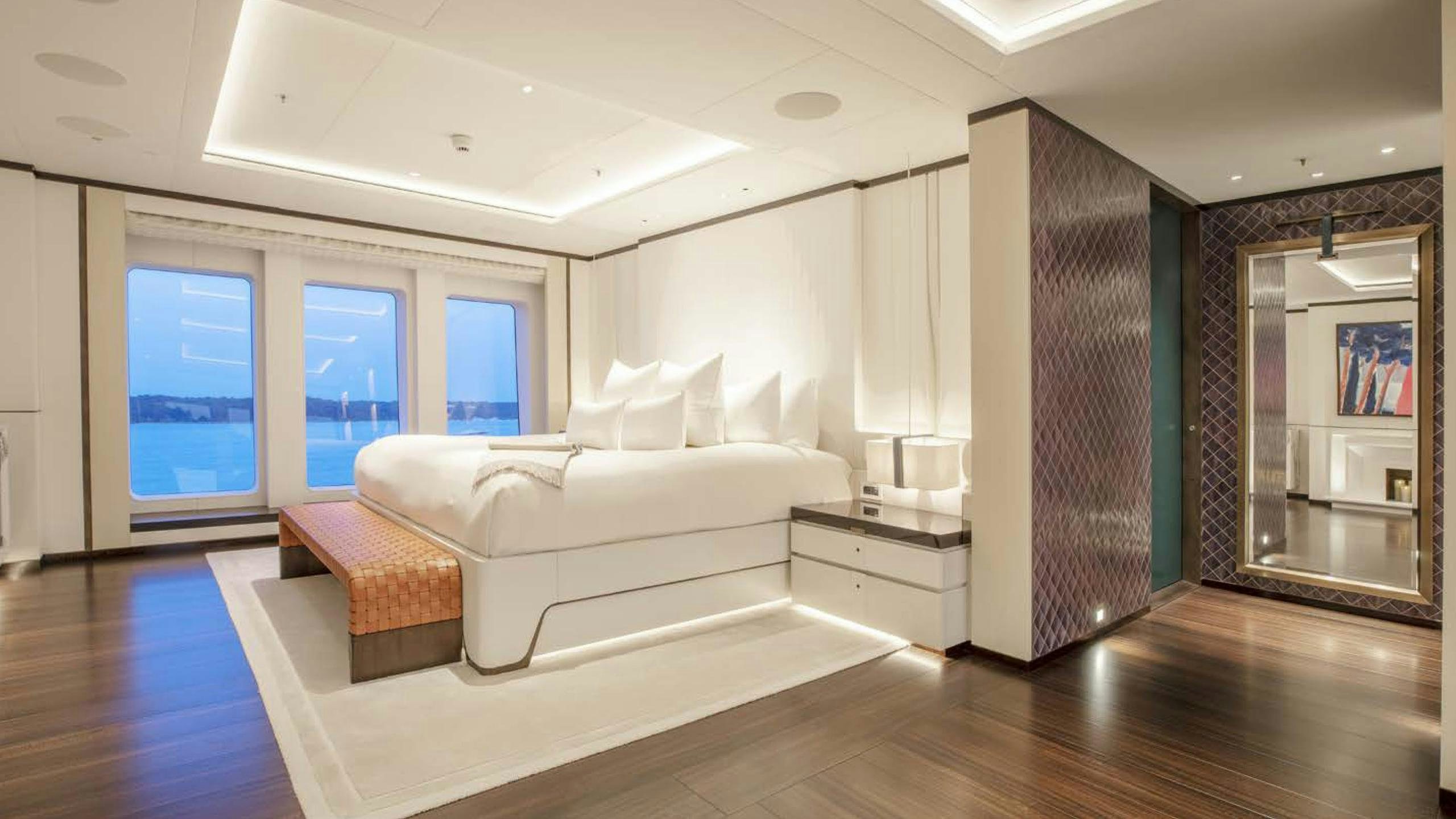 a room with a bed and a couch aboard LUNASEA Yacht for Charter