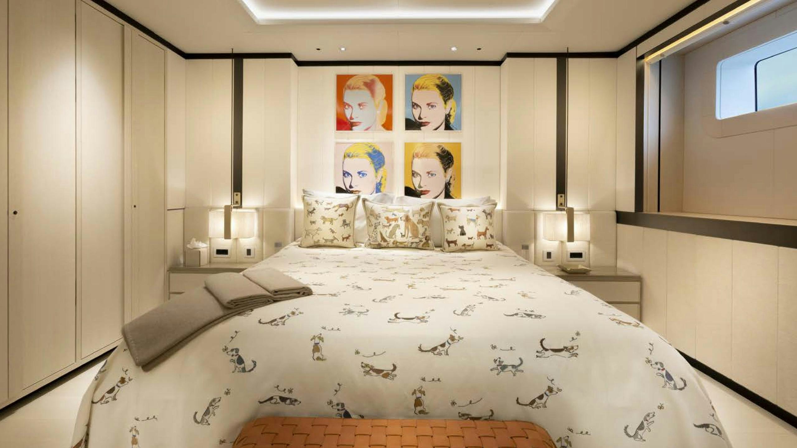 a bed with a white sheet aboard LUNASEA Yacht for Charter