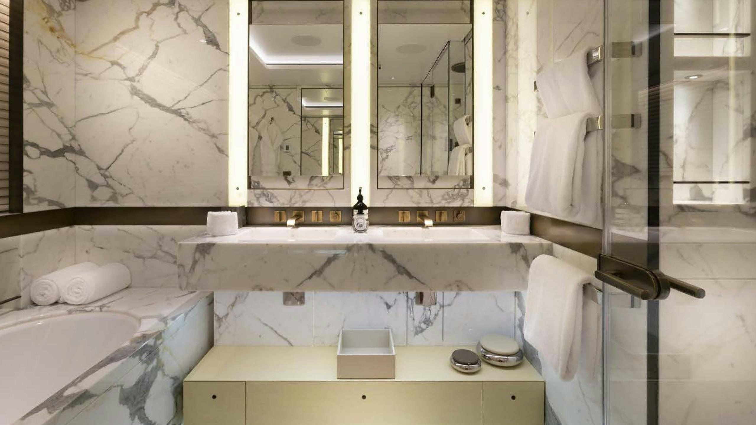 a bathroom with a bathtub and sink aboard LUNASEA Yacht for Charter