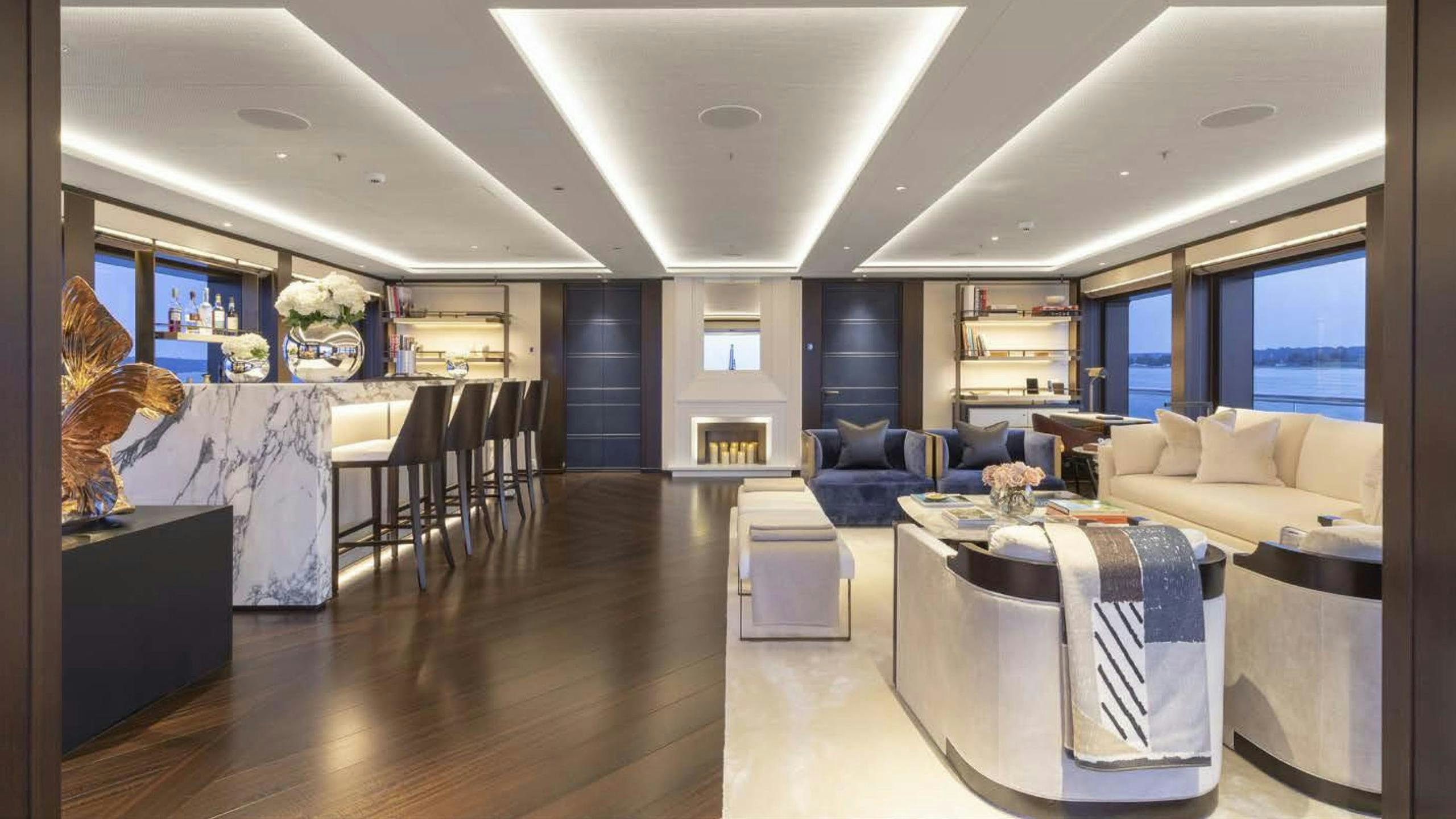 a large room with a large table and chairs aboard LUNASEA Yacht for Charter
