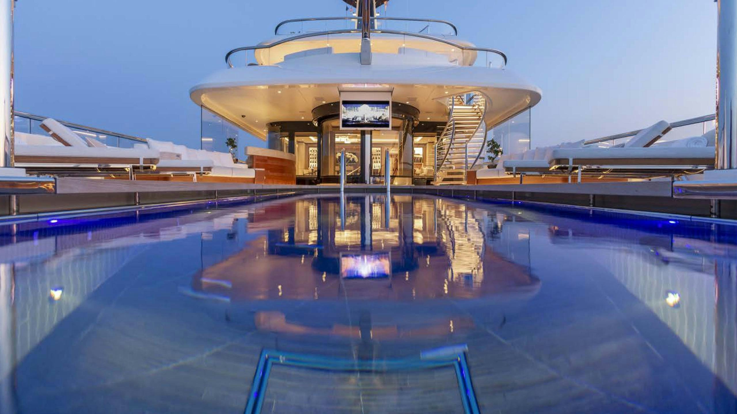 a swimming pool with a building in the background aboard LUNASEA Yacht for Charter