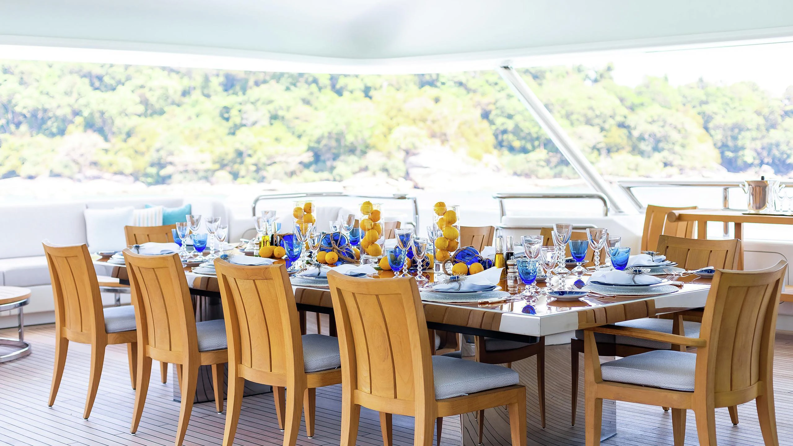 a table set for a dinner party aboard LADY E Yacht for Charter