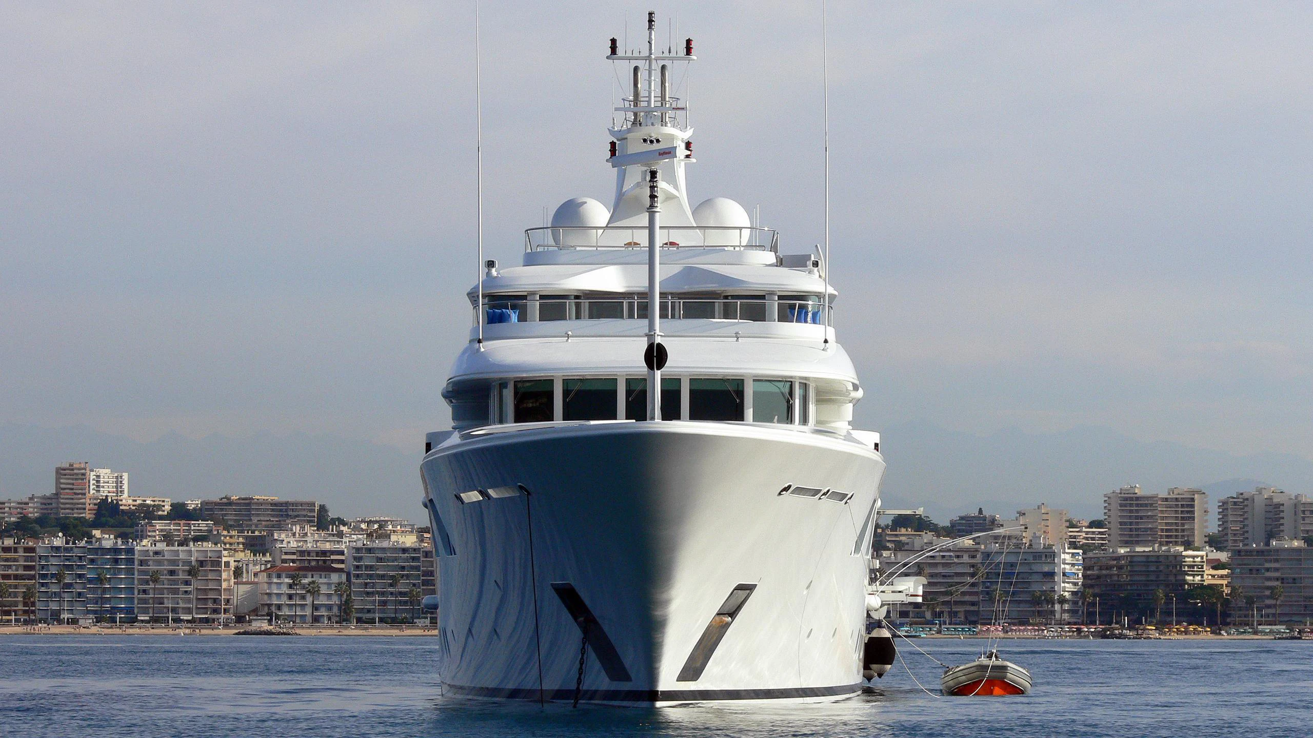 a large white boat in the water aboard LADY E Yacht for Charter