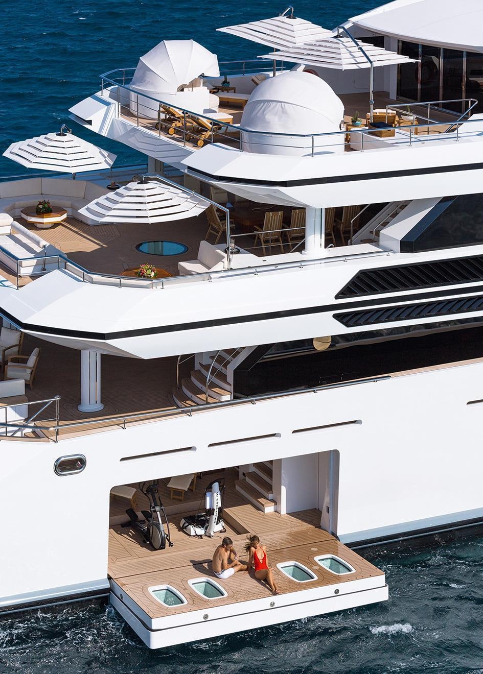 a boat with a couple of people on it aboard ALMAX Yacht for Charter